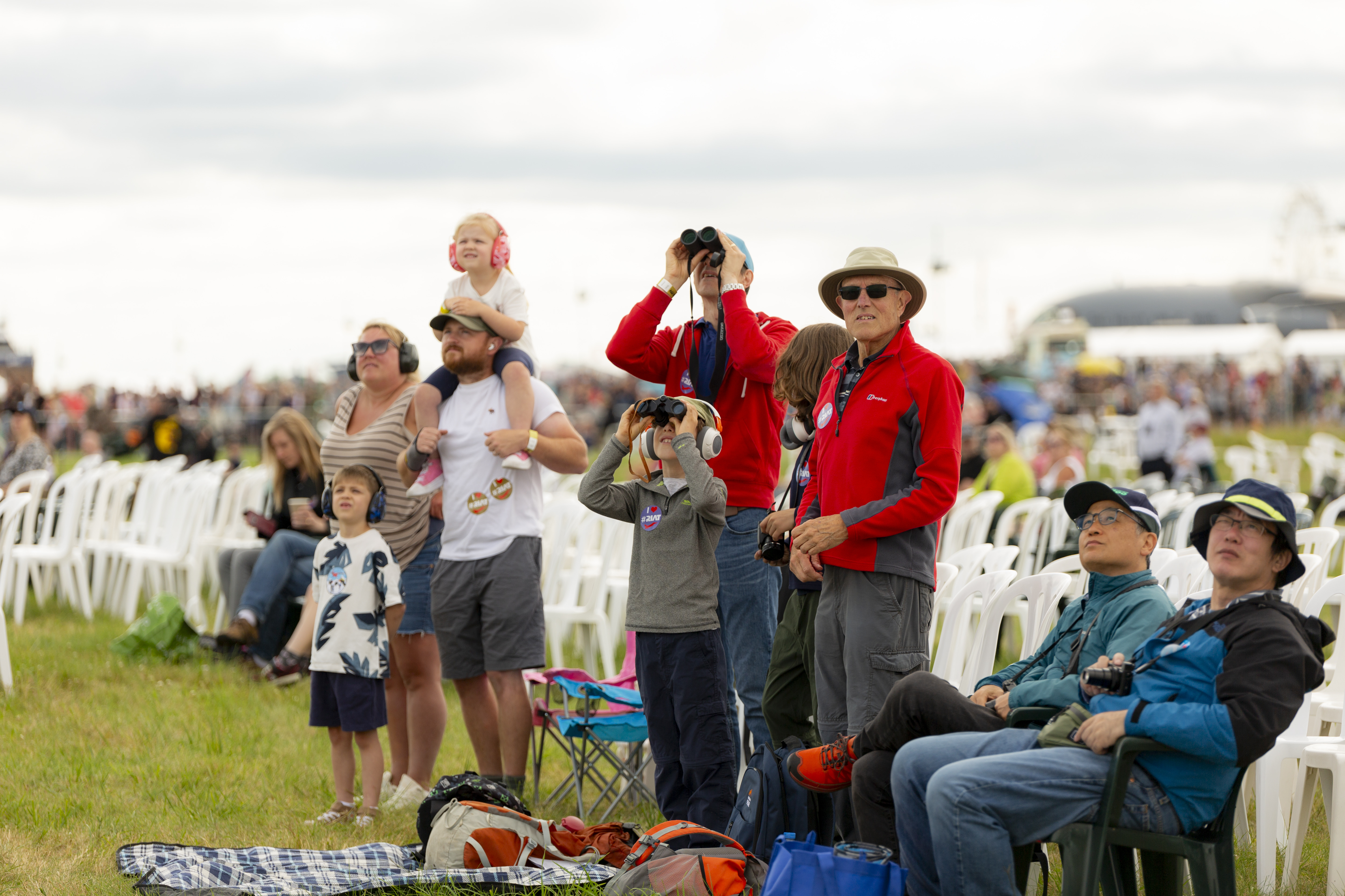 Family In Viewing Village Garden RIAT24