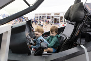 Two young children in the cockpit of an aircraft at RIAT24.