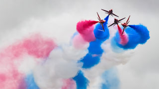 Red Arrows display with red, white and blue smoke at RIAT25.