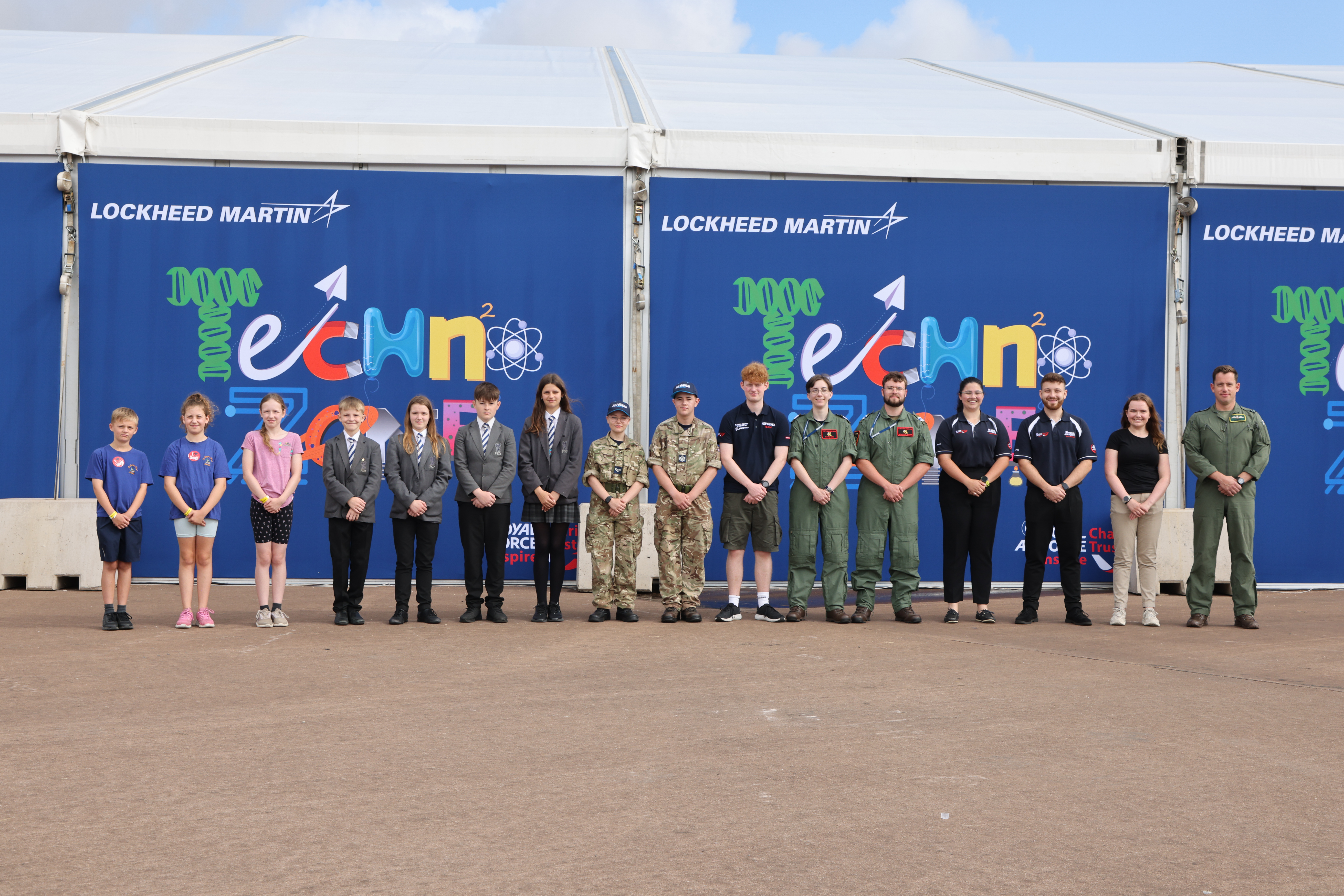 Teenagers and cadets in front of the Techno Zone sign at RIAT25.