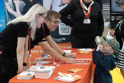 Boy at exhibit in the Techno Zone at RIAT25.