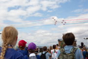 Two children watching the Red Arrows on Friday Futures day at RIAT25.