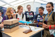 Girls in front of Amazon stand in the Techno Zone at RIAT25.